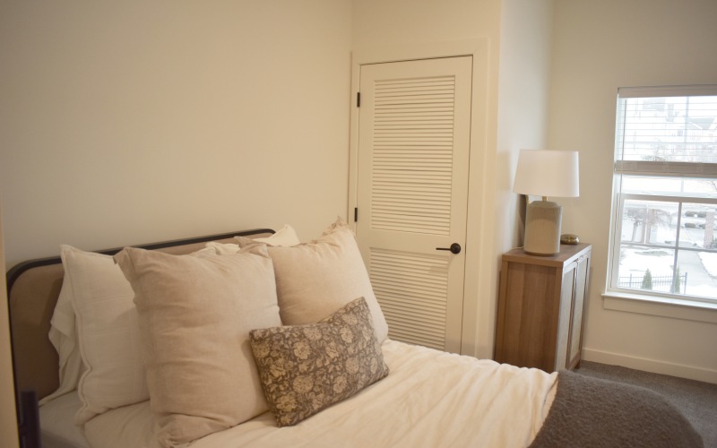 a room with a bed and a window